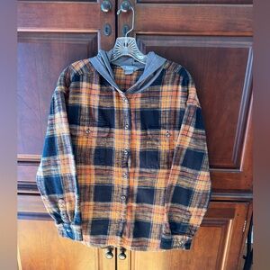 Naturals black/orange plaid flannel shirt. Women’s size Large.